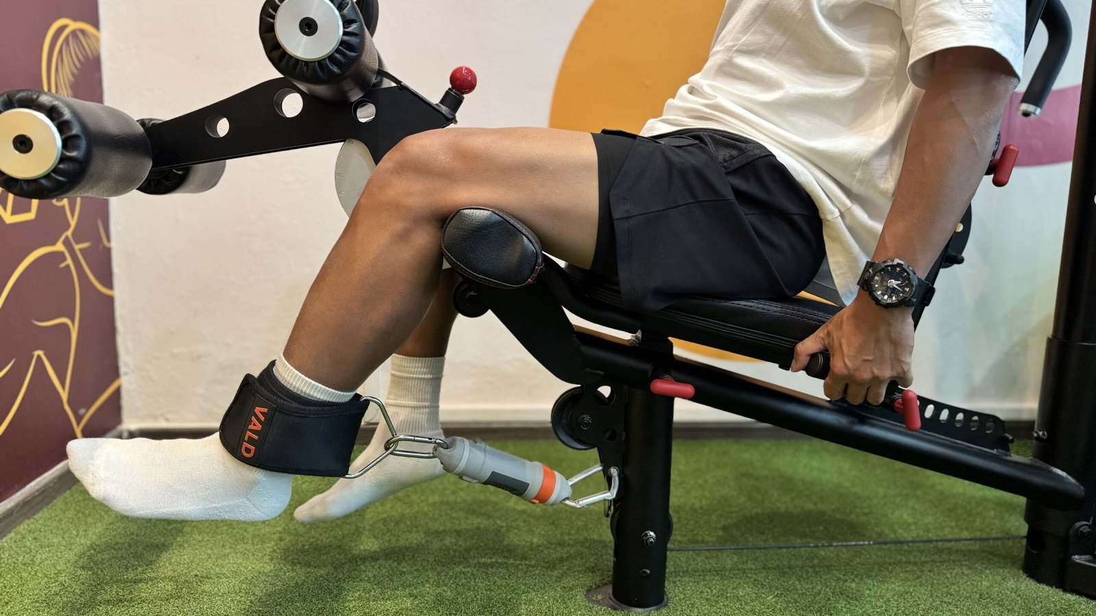 Close up of patient sitting on machine pushing into VALD